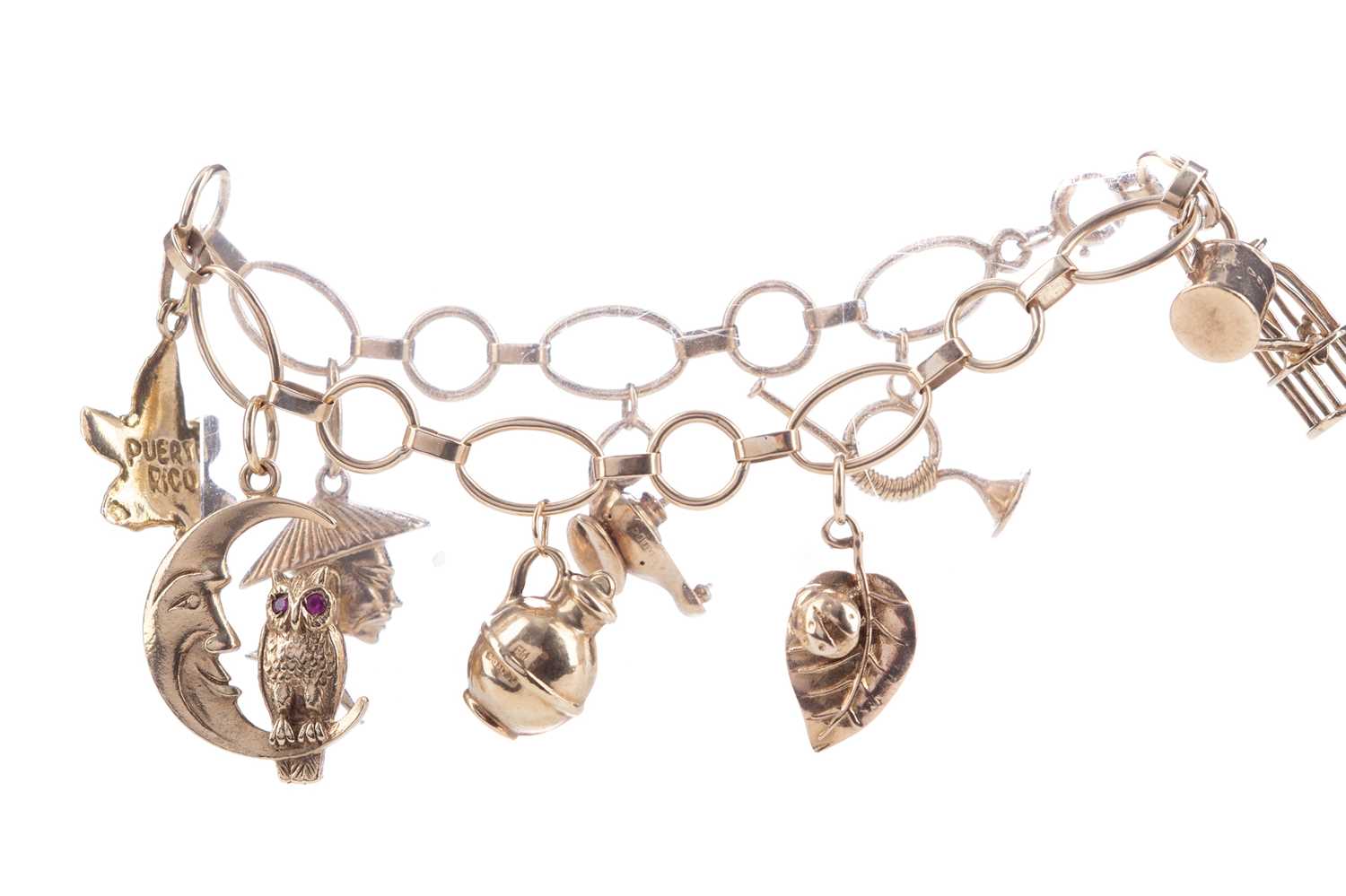 Lot 1172 - A GOLD CHARM BRACELET