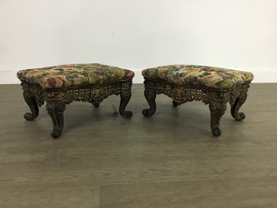 Lot 759 - A PAIR OF CAST AND PIERCED BRASS FOOTSTOOLS OF ROCOCO DESIGN