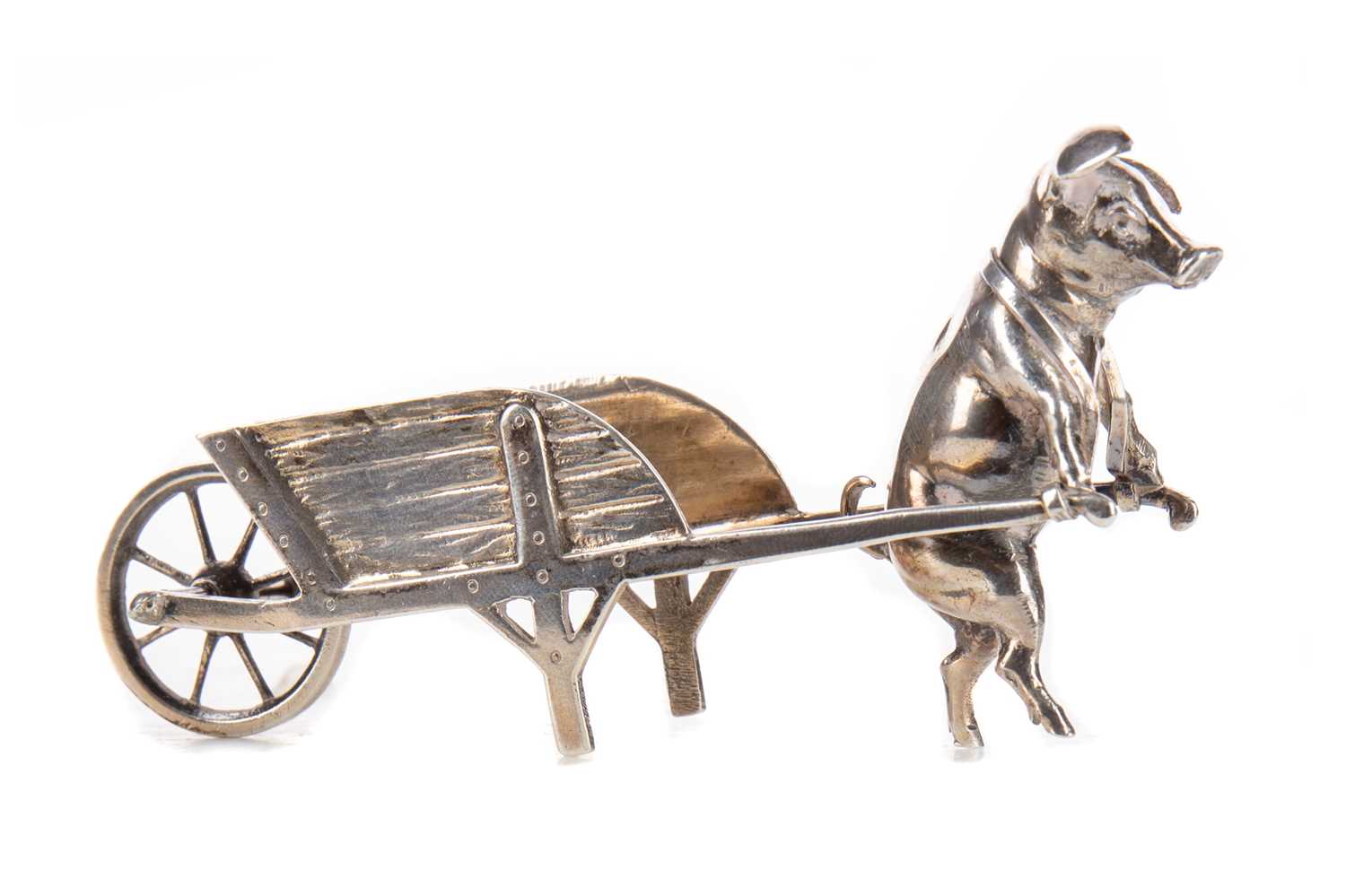 Lot 20 - A PSEUDO-HANAU NOVELTY SILVER FIGURE OF A PIG PULLING A WHEELBARROW