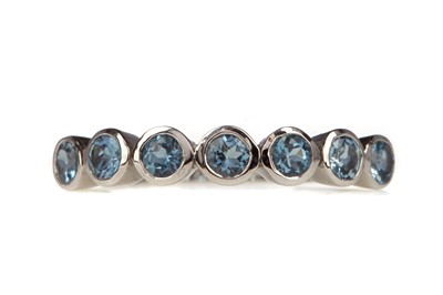 Lot 494 - A BLUE GEM SET BAND ALONG WITH A GOLD PLATED GEM SET BOMBE RING