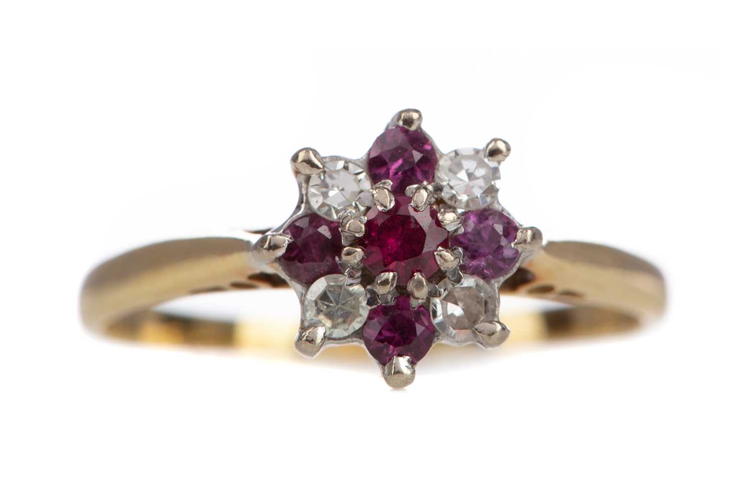 Lot 1121 - A RUBY AND DIAMOND CLUSTER RING