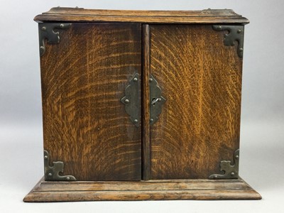 Lot 10 - AN EARLY 20TH CENTURY OAK SMOKER'S CABINET AND A DOULTON BOTTLE VASE