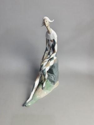 Lot 271 - A NAO FIGURE OF A SEATED CLOWN AND THREE OTHER FIGURES