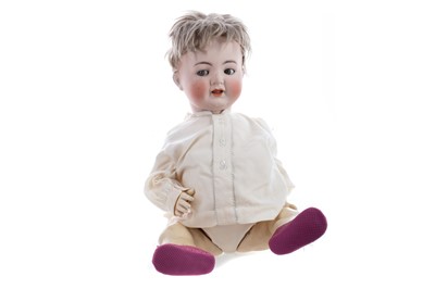 Lot 1130 - A SIMON & HALBIG BISQUE HEADED BOY DOLL