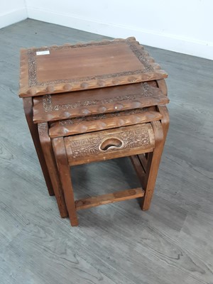 Lot 296 - A CARVED WOOD NEST OF THREE TABLES AND ANOTHER NEST