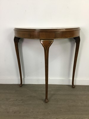 Lot 308 - A DEMI LUNE TABLE