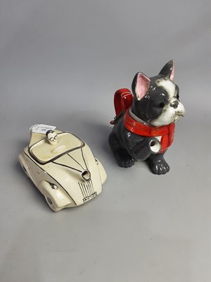 Lot 320 - A CREAM COLOURED RACING CAR TEA POT AND ANOTHER