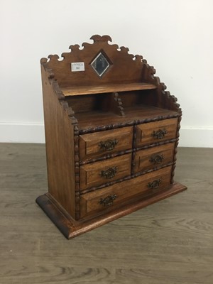 Lot 322 - A SMALL TABLE TOP CABINET OF DRAWERS