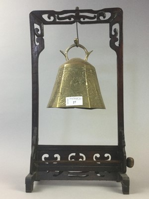 Lot 27 - A CHINESE BRASS BELL ON HARDWOOD STAND