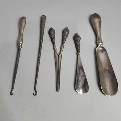 Lot 169 - A MATCHED THREE PIECE SILVER HANDLED VANITY SET AND TWO OTHERS