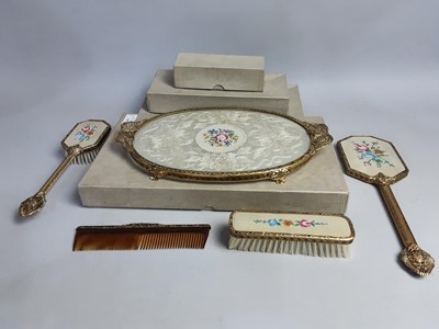 Lot 392 - A BOXED BRASS AND EMBROIDERED DRESSING TABLE SET