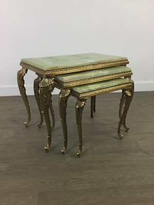 Lot 344 - A NEST OF THREE BRASS AND ONYX TABLES