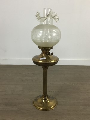 Lot 428 - A BRASS OIL LAMP AND ANOTHER