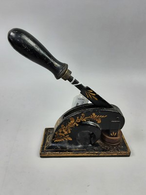 Lot 486 - A VICTORIAN STAMP EMBOSSER, ALONG WITH A CLOCK