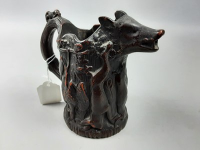 Lot 528 - A 19TH CENTURY HUNT JUG AND CARVED MODELS OF BIRDS