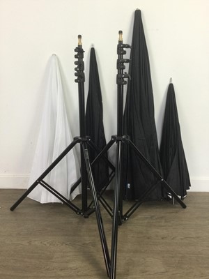 Lot 643 - FOUR STUDIO UMBRELLAS AND TWO STANDS