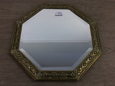 Lot 225 - A BRASS FRAMED OCTAGANOL BEVELLED WALL MIRROR