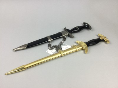 Lot 262 - A REPRODUCTION S.S. SWORD ALONG WITH TWO REPRODUCTION DAGGERS