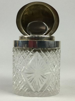 Lot 60 - A LATE VICTORIAN SILVER MOUNTED CUT GLASS PERFUME BOTTLE