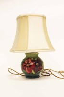 Lot 1106 - MOORCROFT CLEMATIS PATTERN LAMP BASE decorated...