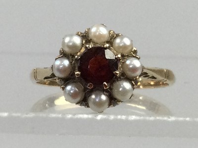 Lot 343 - A GARNET AND PEARL CLUSTER RING