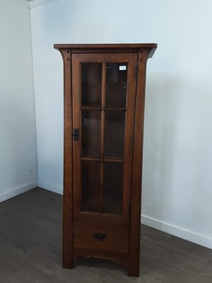 Lot 393 - A MODERN OAK NARROW DISPLAY CABINET