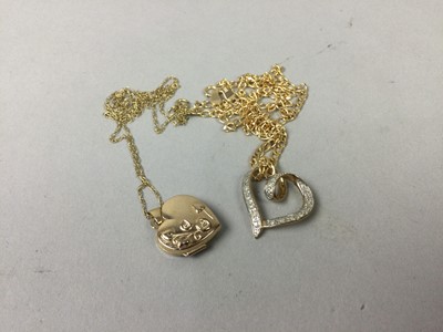 Lot 519 - A DIAMOND SET GOLD HEART PEDANT ON A GOLD CHAIN AND A LOCKET ON CHAIN