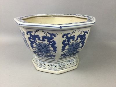 Lot 523 - A CHINESE BLUE AND WHITE PLANTER AND A VASE