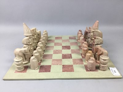 Lot 526 - AN AFRICAN HARDSTONE CHESS SET