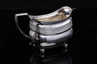 Lot 514 - GEORGE III OBLONG SILVER MILK JUG decorated...