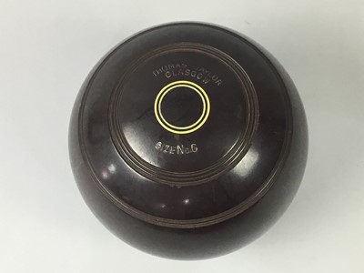 Lot 64 - A SET OF FOUR LAWN BOWLS