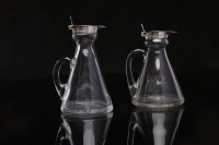 Lot 518 - TWO SILVER MOUNTED GLASS WHISKY TOTS the...