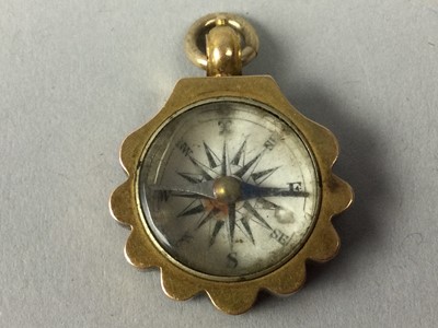 Lot 135 - TWO COMPASS PENDANTS