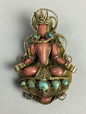 Lot 144 - A CORAL AND TURQUOISE DEITY BROOCH