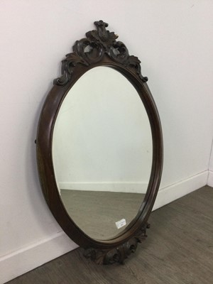 Lot 213 - AN OVAL BEVELLED WALL MIRROR