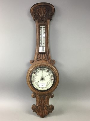 Lot 511 - AN OAK CARVED ANEROID BAROMETER AND A CIRCULAR BAROMETER
