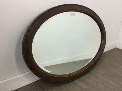 Lot 515 - A MAHOGANY OVAL WALL MIRROR AND ANOTHER OVAL MIRROR