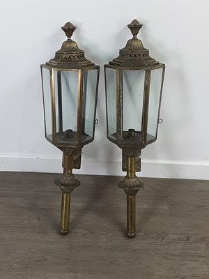 Lot 734 - A PAIR OF EARLY 20TH CENTURY BRASS WALL LANTERNS