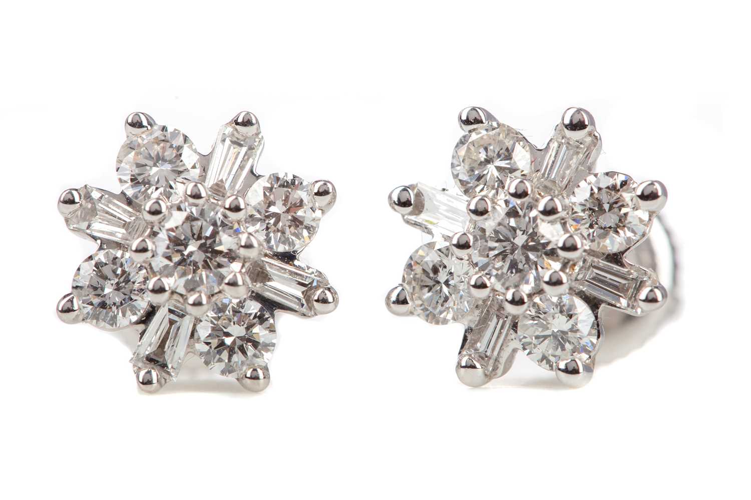 Lot 659 - A PAIR OF DIAMOND FLOWER CLUSTER EARRINGS
