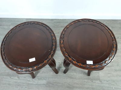 Lot 67 - A PAIR OF CARVED CIRCULAR TABLES