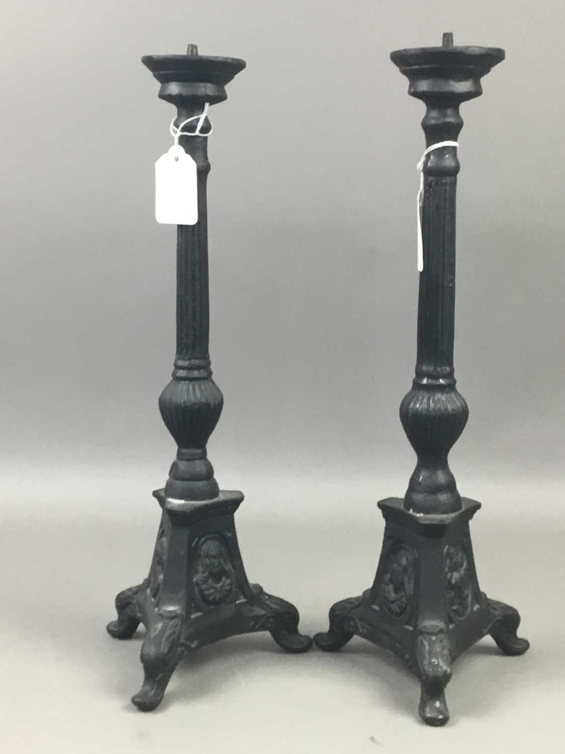 Lot 78 - A PAIR OF CAST IRON CANDLESTICKS AND A FIRE COMPANION