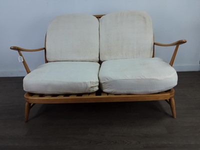 Lot 115 - AN ERCOL SOFA AND MATCHING CHAIR
