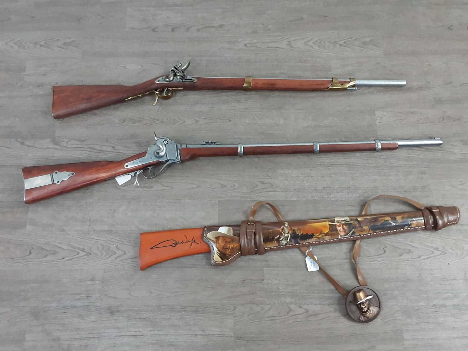 Lot 273 - A REPRODUCTION FLINTLOCK MUSKET, A REPRODUCTION PERCUSSION RIFLE AND A WALL MOUNTING RIFLE