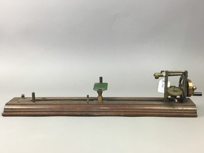 Lot 222 - A 19TH CENTURY BRASS YARN TESTER