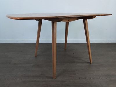 Lot 380 - AN ERCOL  DROP LEAF DINING TABLE