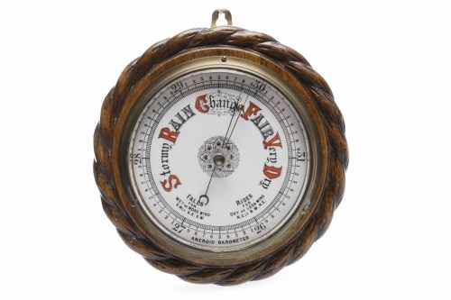 Lot 1015 - AN EARLY 20TH CENTURY ANEROID BAROMETER in...