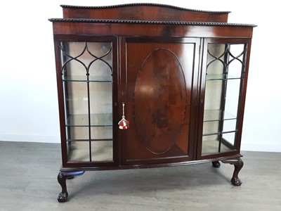 Lot 250 - A MAHOGANY BOW FRONTED THREE DOOR DISPLAY CABINET