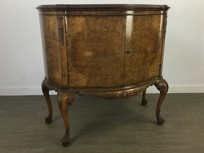 Lot 252 - A BURR WALNUT SERPENTINE FRONTED TWO DOOR CUPBOARD