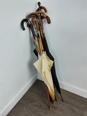 Lot 294 - A SHOOTING STICK, OTHER STICKS AND UMBRELLAS
