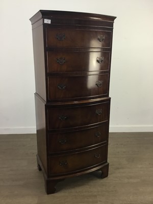 Lot 299 - A REPRODUCTION MAHOGANY BOW FRONTED TALLBOY CHEST OF SIX DRAWERS AND A CABINET